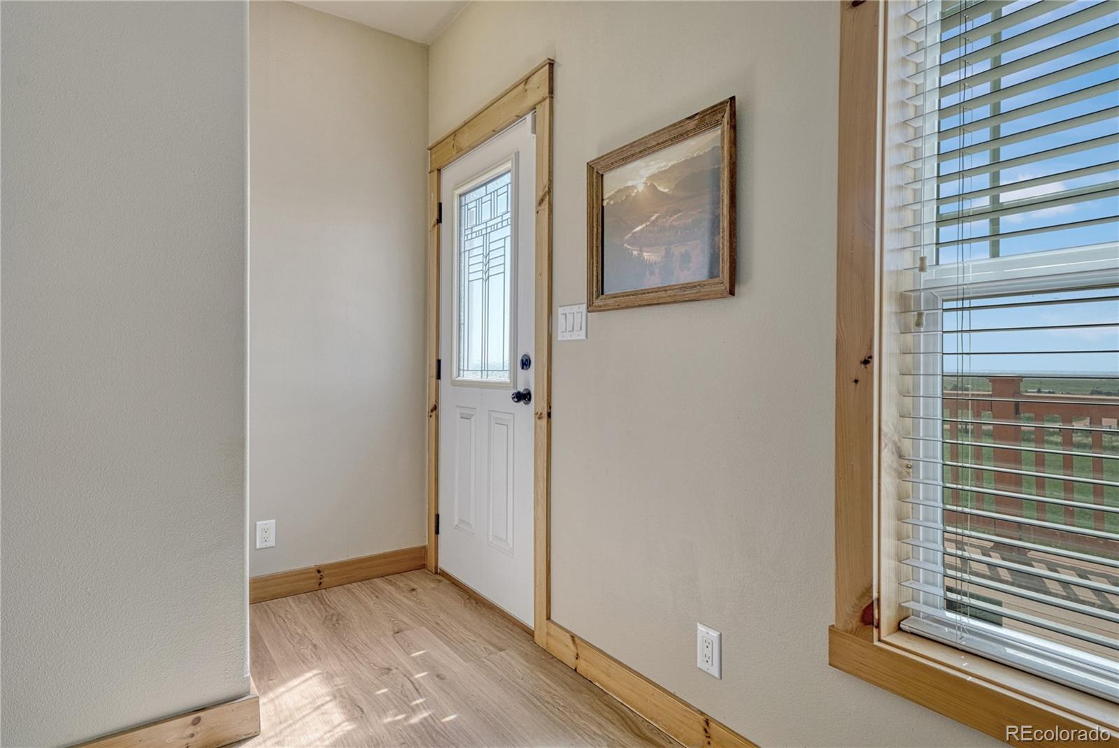 17355 Wagon Train Loop Peyton, CO 80831 - Photo 5 of 48 a view of an empty room and window