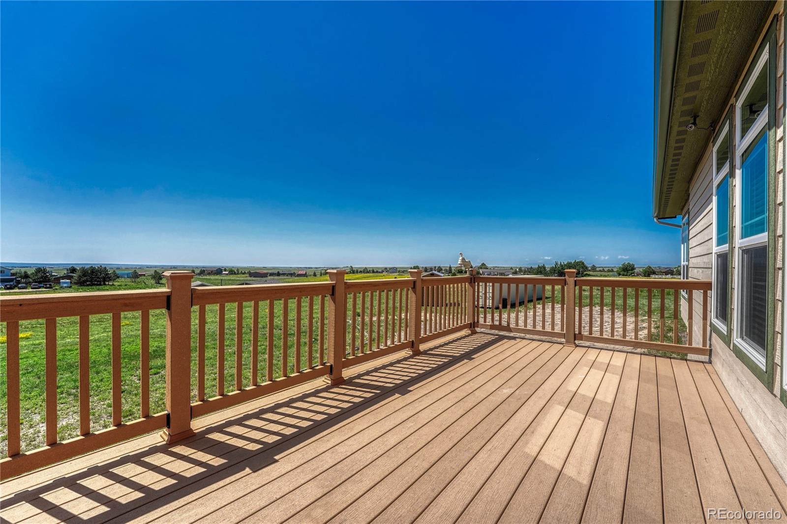 17355 Wagon Train Loop Peyton, CO 80831 - Photo 6 of 48 a view of balcony with wooden floor