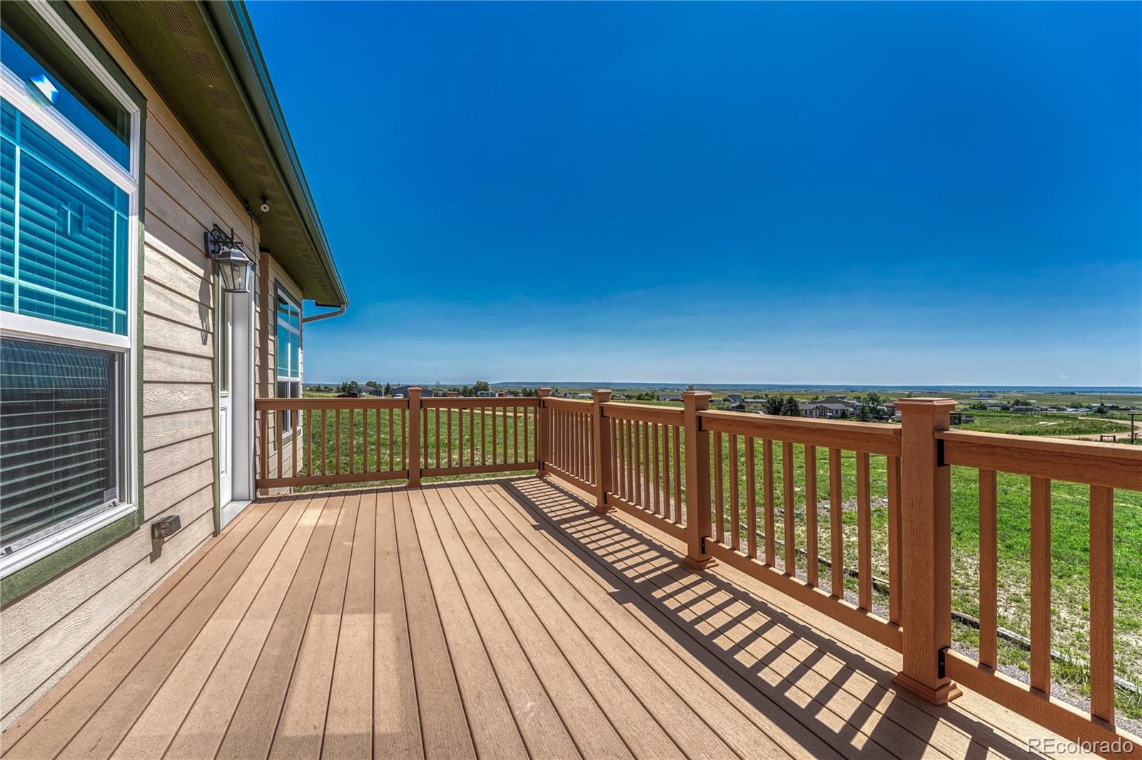 17355 Wagon Train Loop Peyton, CO 80831 - Photo 7 of 48 a view of balcony with wooden floor