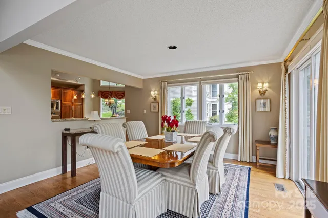 a view of a dining room with furniture and a window