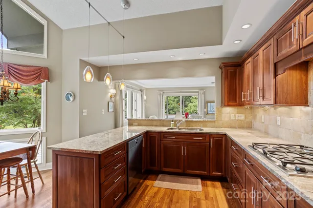a kitchen with a sink stove and cabinets