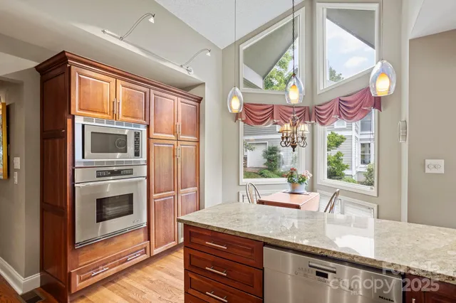 a kitchen with a stove a sink and a refrigerator