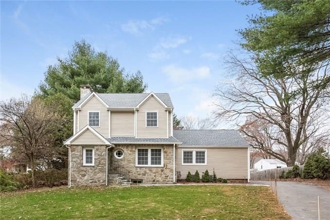 253 West Rocks Road Norwalk, CT 06851 - Photo 1 of 1 a front view of a house with a garden