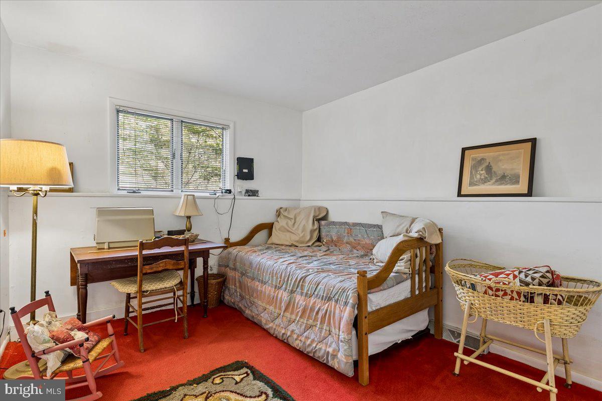10087 John Carvill Road Chestertown, MD 21620 - Photo 35 of 63 a bedroom with a bed and a desk