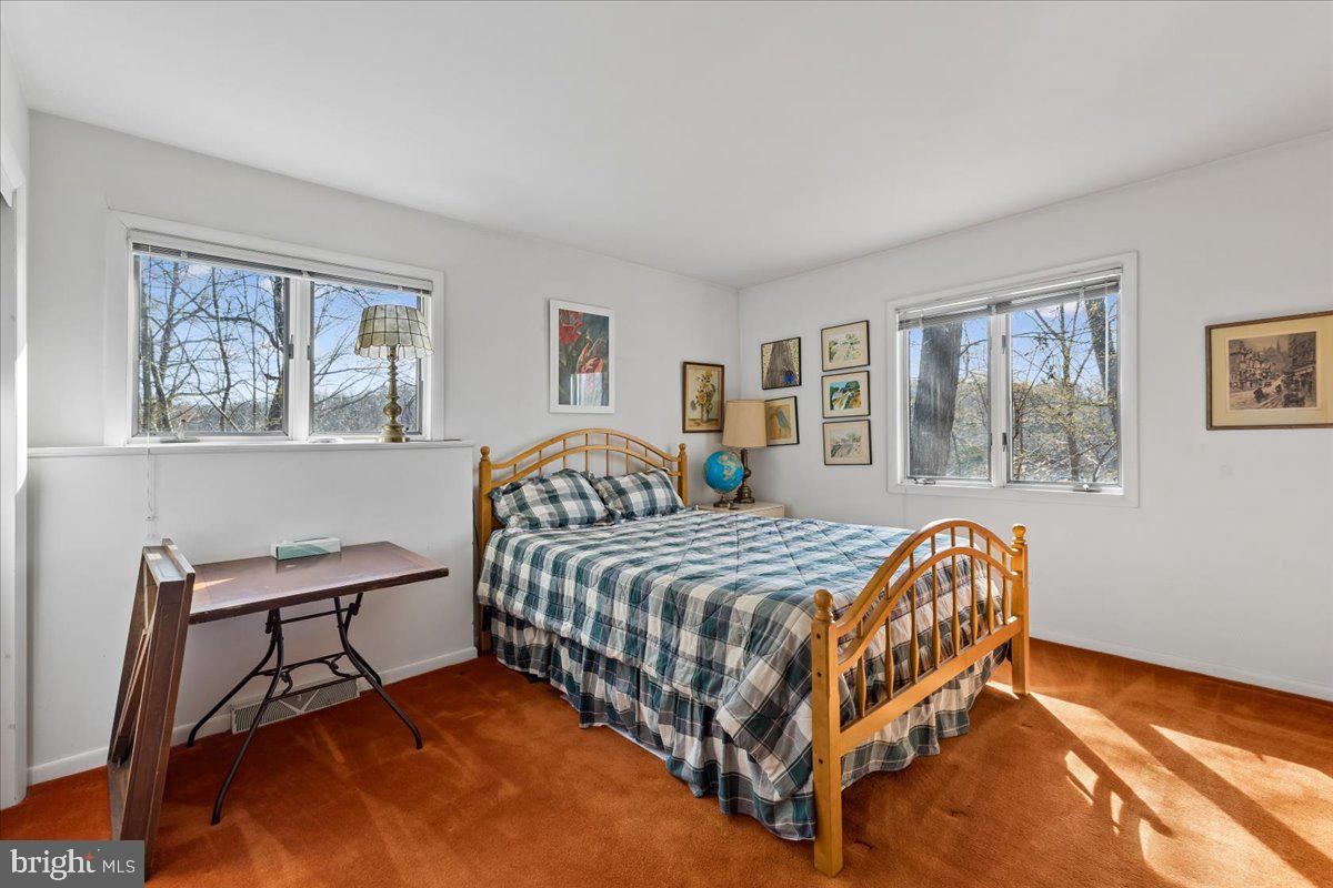 10087 John Carvill Road Chestertown, MD 21620 - Photo 39 of 63 a bedroom with a bed chair and window