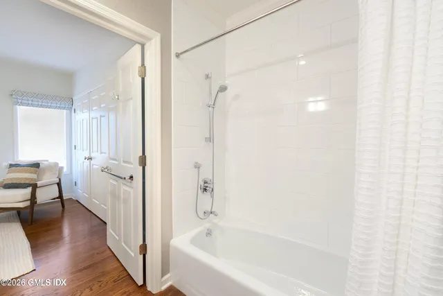 a bathroom with a bathtub and a shower