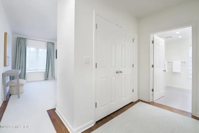 a view of a hallway with bathroom