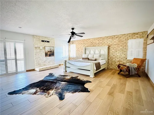 a spacious bathroom with a double vanity sink a mirror and a bathtub