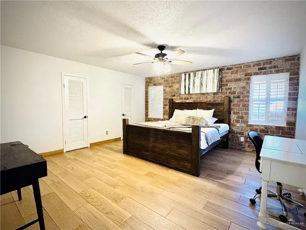 a view of a kitchen with sink and cabinets