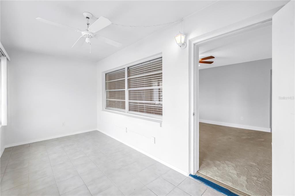 4700 Cove Circle, Unit 103 St. Petersburg, FL 33708 - Photo 5 of 31 a view of an empty room with a window