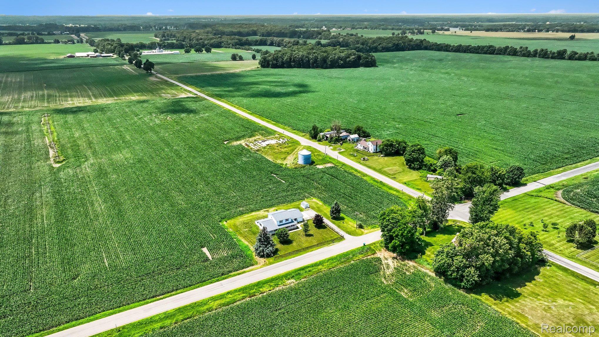 996 Arbogast Road Union City, MI 49094 - Photo 30 of 34 Expansive agricultural landscape featuring vast green fields and scattered residential properties