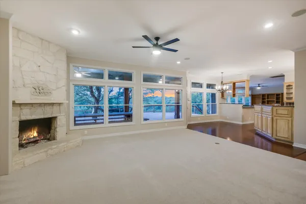 a kitchen with stainless steel appliances granite countertop a sink a stove top oven a counter space and cabinets