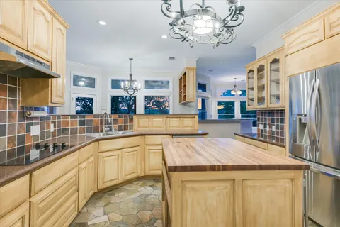 a view of living room with furniture and large windows