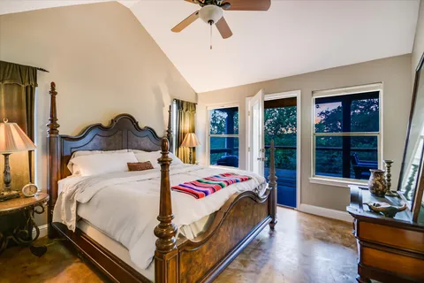 a bedroom with furniture and a window