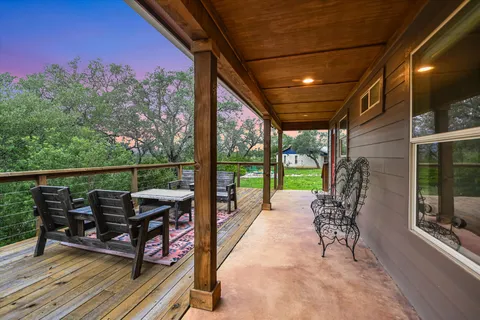 a view of a house with yard and tree s