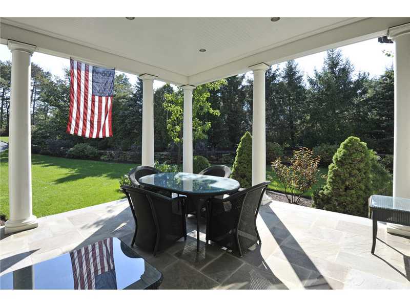 78 Doubling Road Greenwich, CT 06830 - Photo 16 of 20 a view of a patio with a table chairs and a backyard