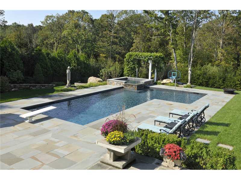78 Doubling Road Greenwich, CT 06830 - Photo 18 of 20 a view of a swimming pool with a patio