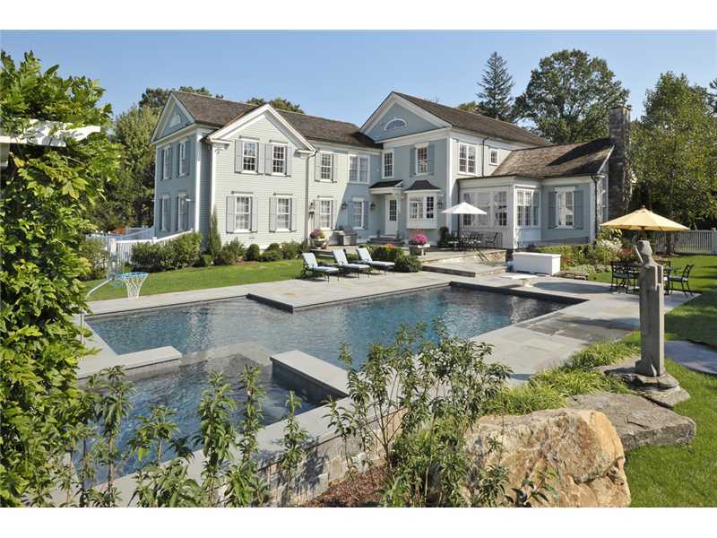 78 Doubling Road Greenwich, CT 06830 - Photo 19 of 20 a front view of a house with a garden and plants