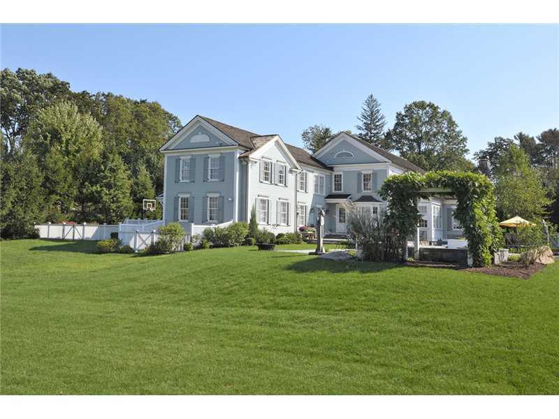 78 Doubling Road Greenwich, CT 06830 - Photo 20 of 20 a front view of a house with a garden