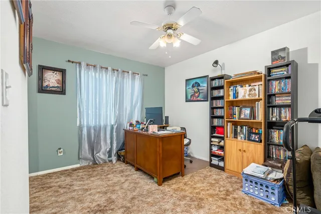 a view of room with toys and a chandelier