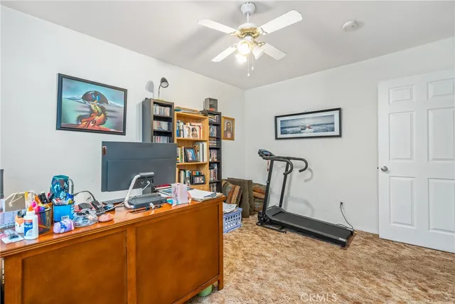 a room with furniture a rug and a window