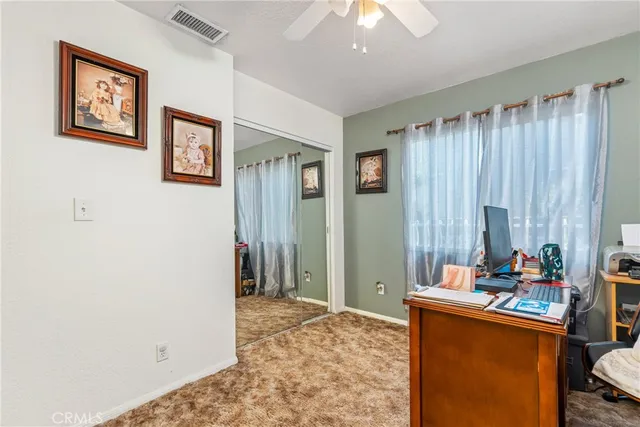 a bed room with a bed and a window