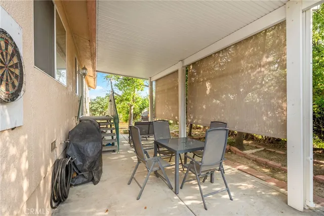 a dining room with furniture water view and balcony