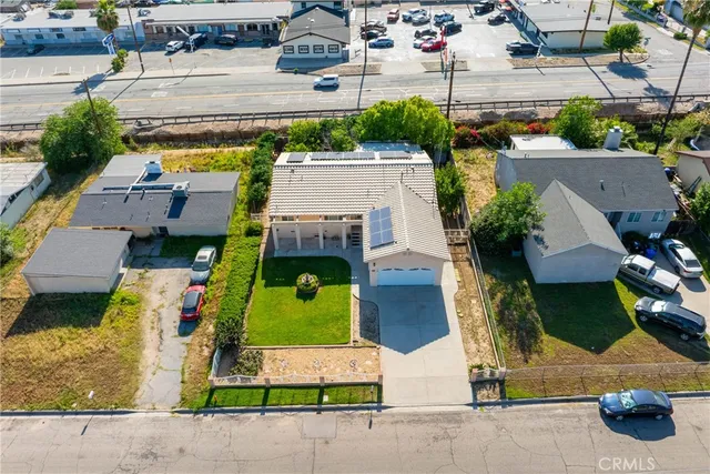 an aerial view of a house with a garden and plants