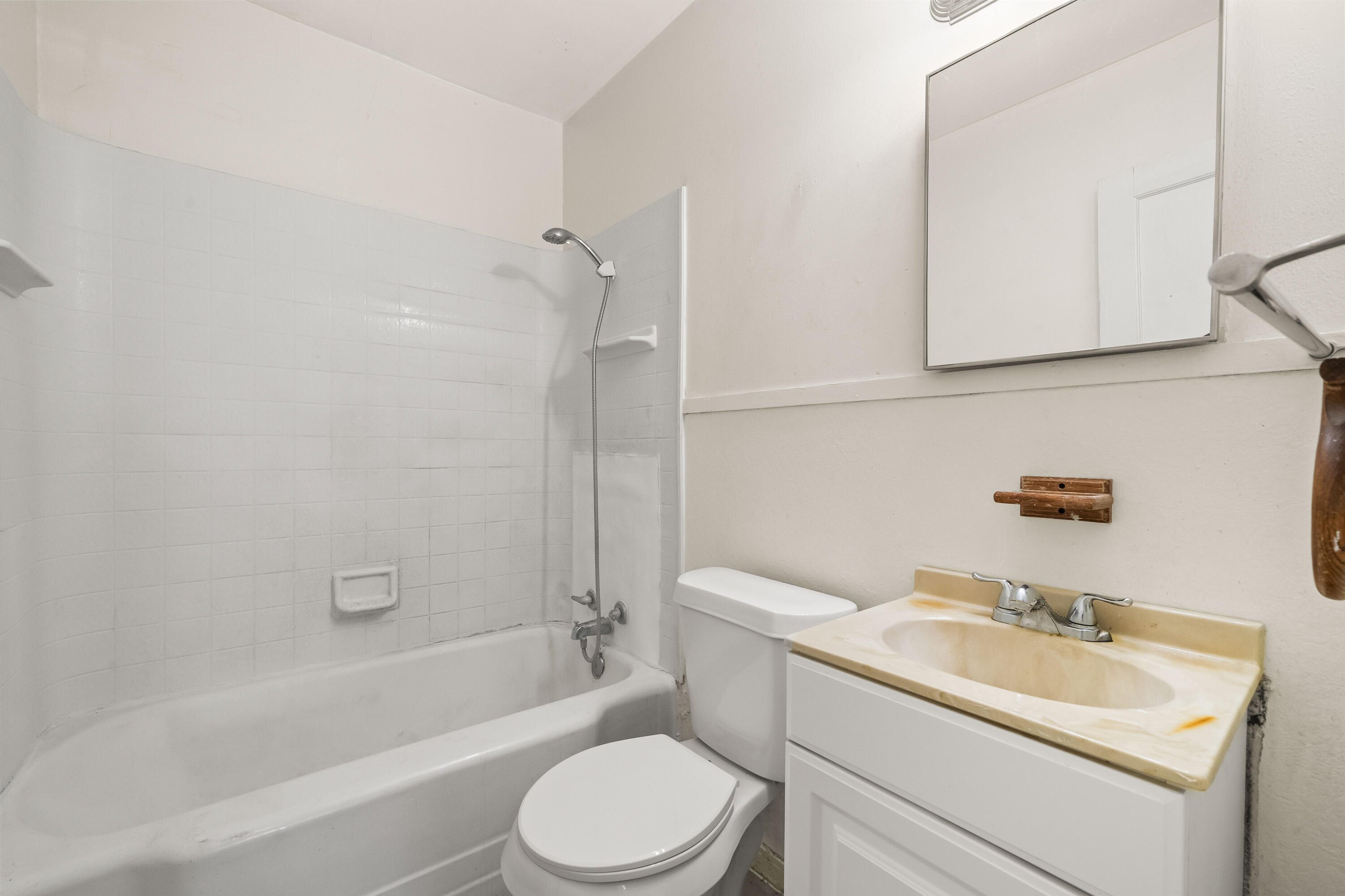 1718 46th Street Lubbock, TX 79412 - Photo 13 of 17 a bathroom with a sink toilet and shower