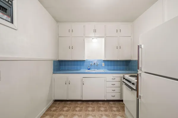 a view of cabinets and wooden floor