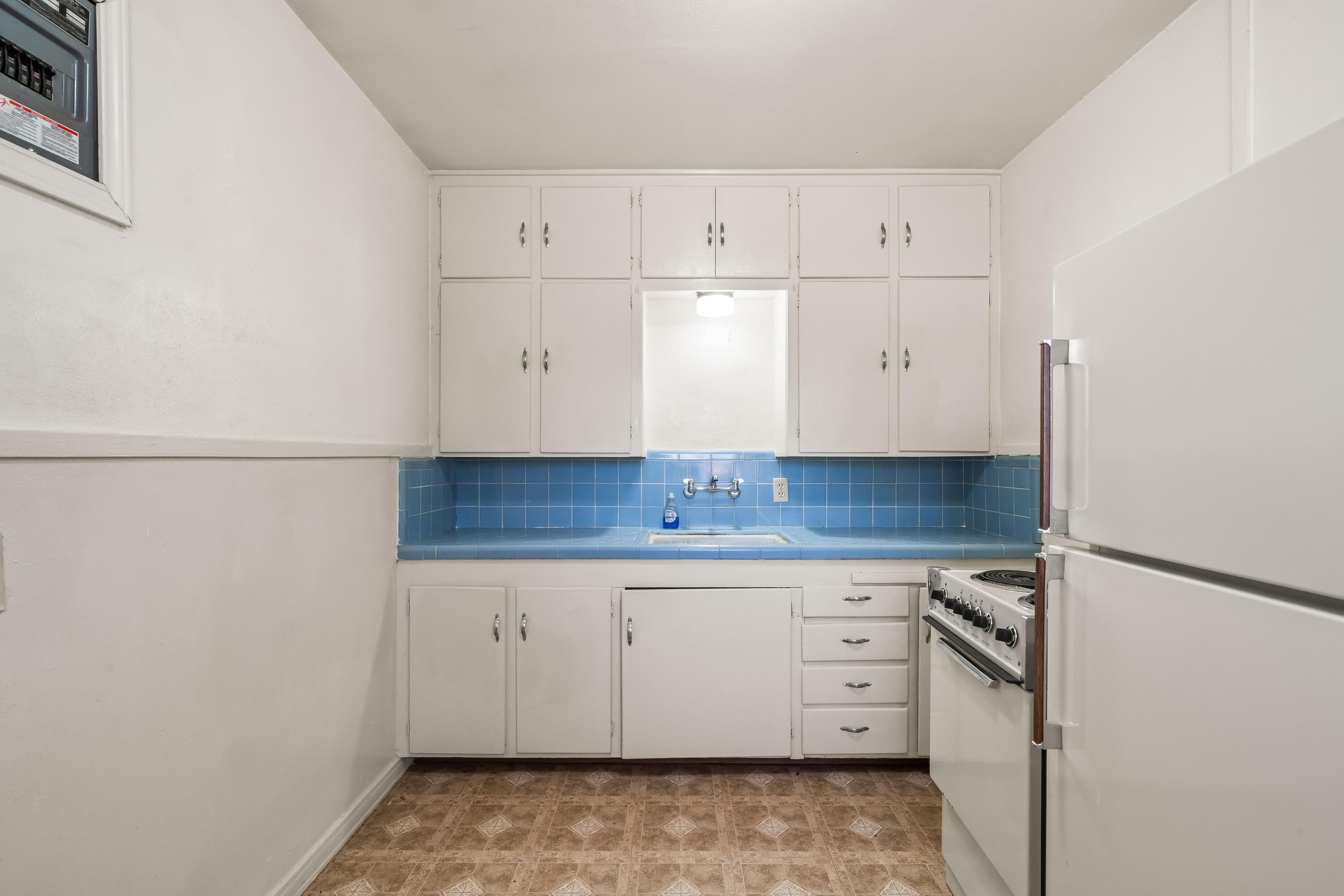 1718 46th Street Lubbock, TX 79412 - Photo 8 of 17 a view of cabinets and wooden floor