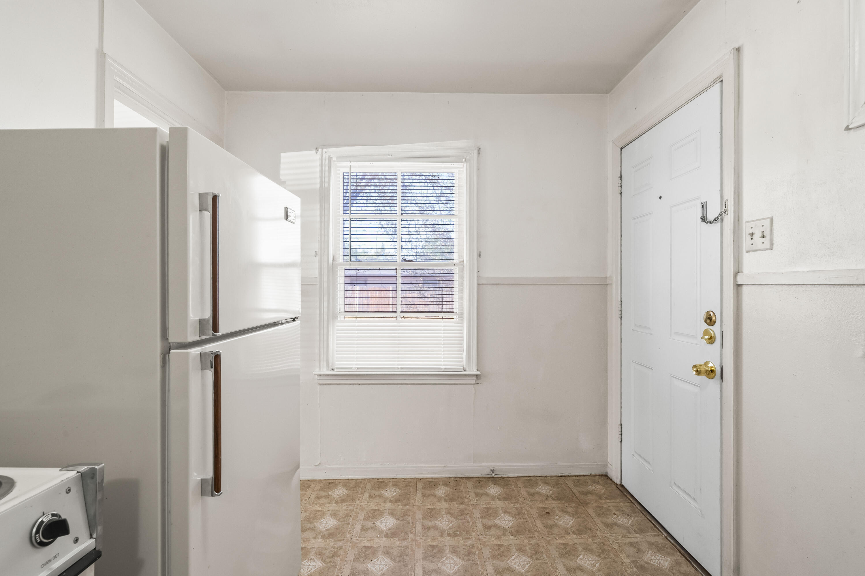 1718 46th Street Lubbock, TX 79412 - Photo 10 of 17 a view of kitchen with a refrigerator cabinet and a window