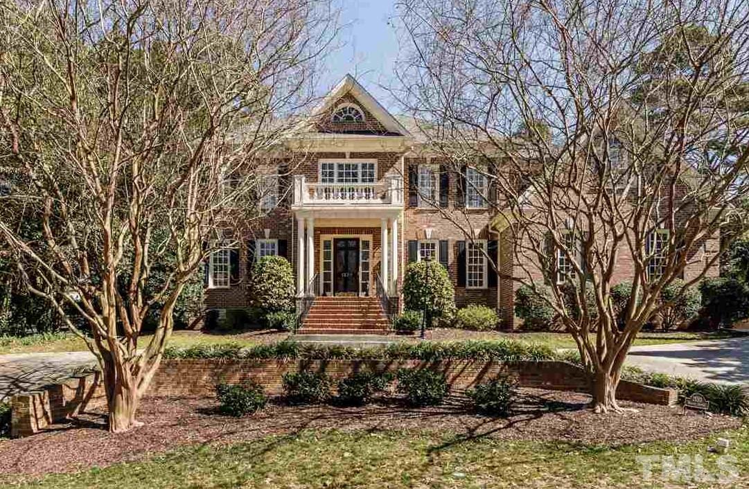 Stately all brick home with classic lines and eye-catching curb appeal!