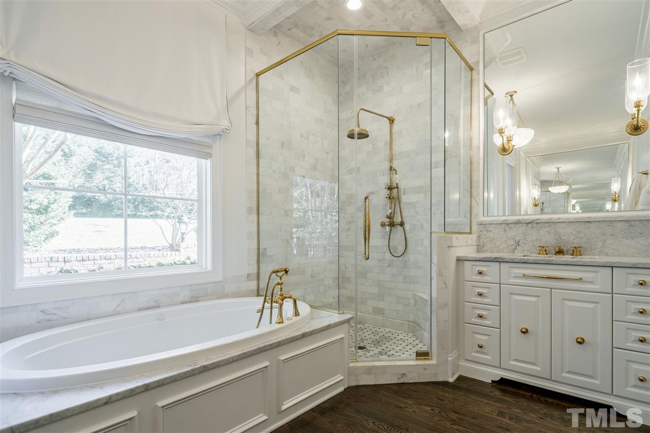 1530 Brooks Avenue Raleigh, NC 27607 - Photo 21 of 30 Marble tile to the ceiling in the walk-in shower! Stunning brass hardware and frameless shower!