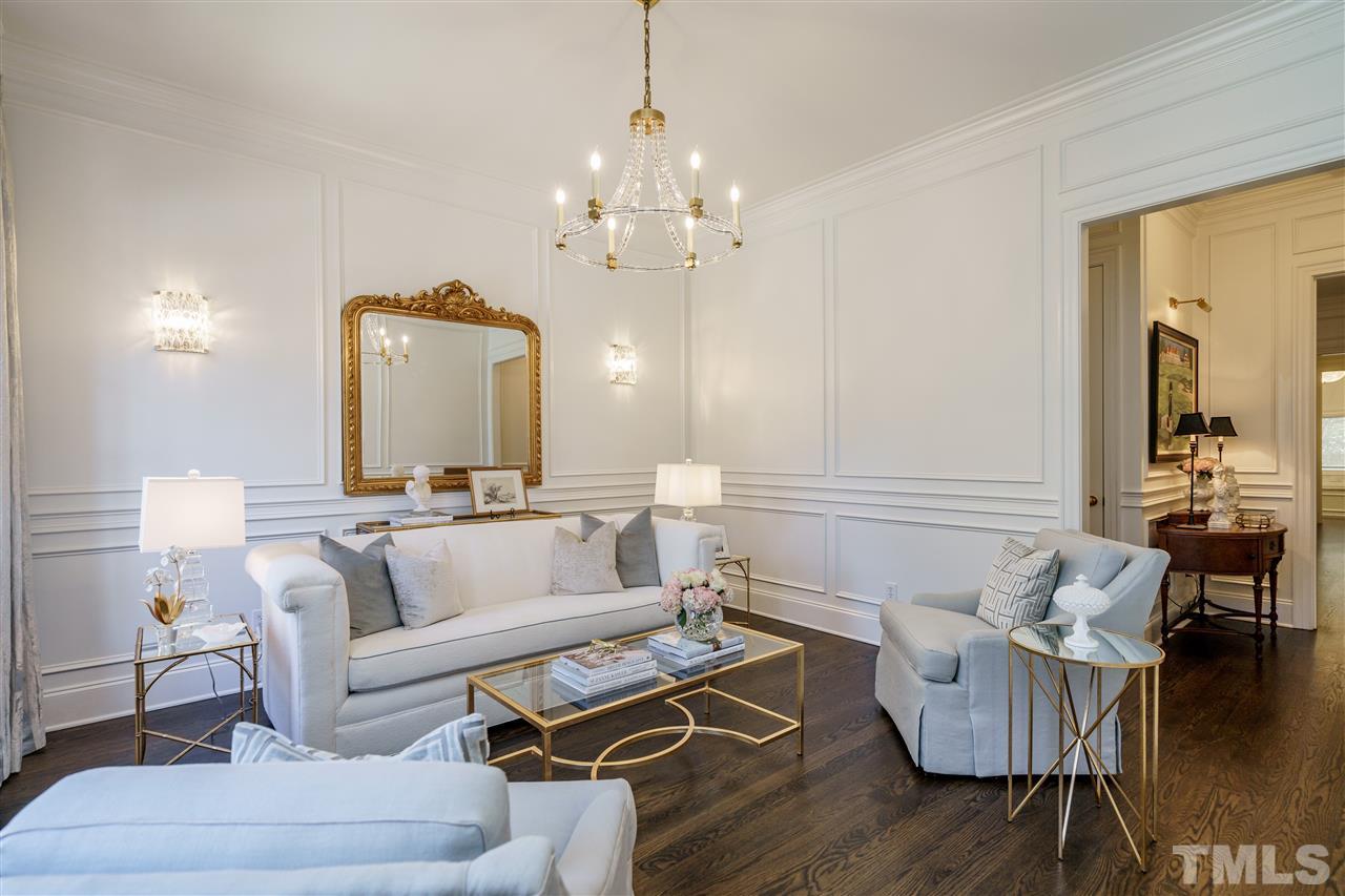 1530 Brooks Avenue Raleigh, NC 27607 - Photo 4 of 30 Who would not enjoy a relaxing afternoon in this stunning living room? Note the beautiful floors and trim work. First floor has 10 foot ceilings!