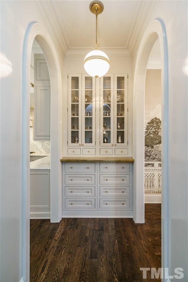 1530 Brooks Avenue Raleigh, NC 27607 - Photo 7 of 30 No detail overlooked in this renovation! Lacquered butler's pantry with brass countertop. Note the spherical light fixture that compliments the arched doorways!