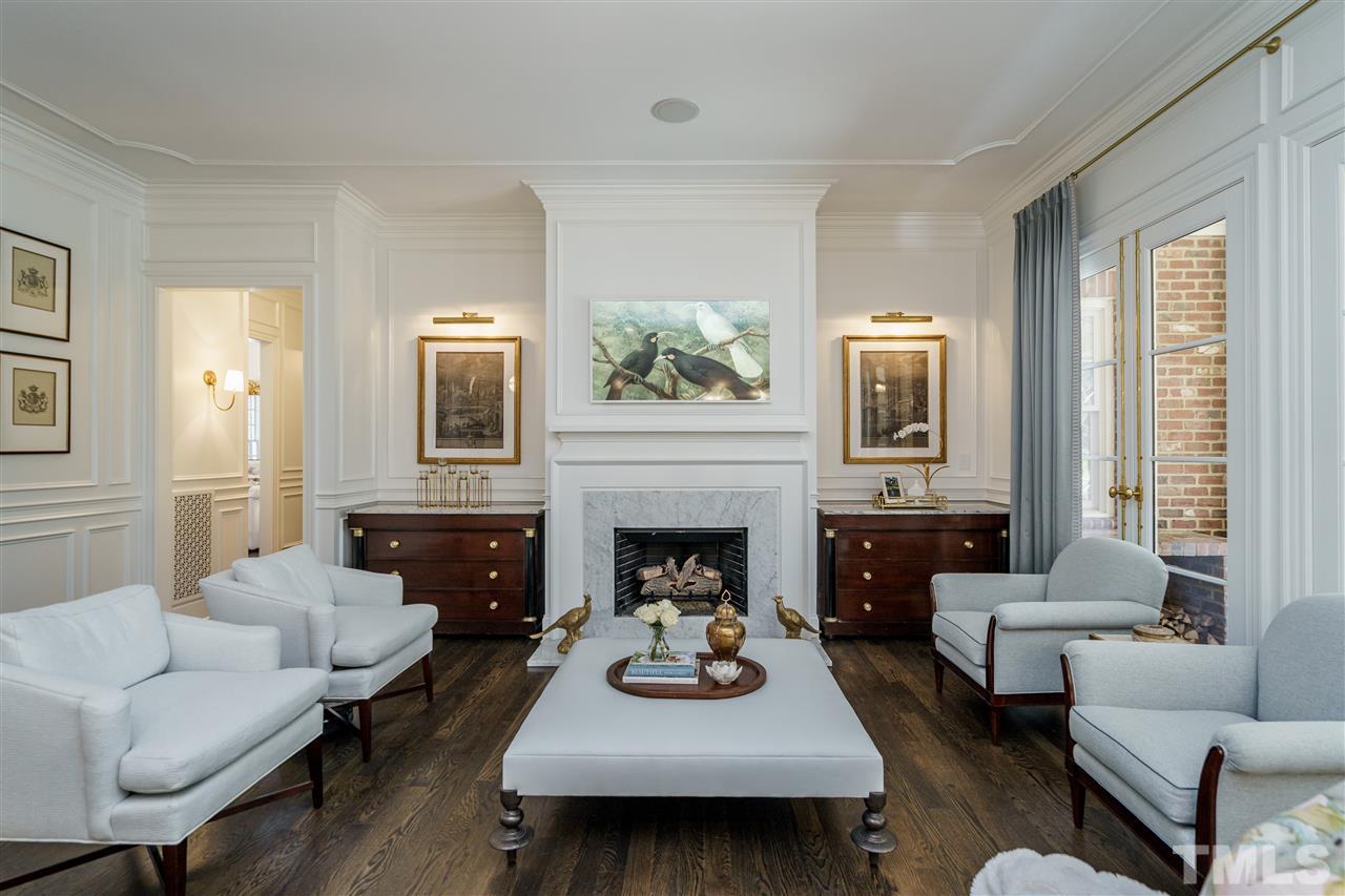 1530 Brooks Avenue Raleigh, NC 27607 - Photo 10 of 30 Is that art or a television? Enjoy this beautiful family room! Perfect for entertaining! Note French doors to the right and accent lighting for artwork flanking the fireplace.