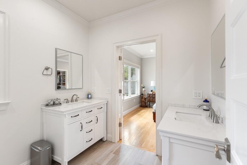 155 Adams Avenue Newton, MA 02465 - Photo 26 of 37 a bathroom with a sink a toilet and vanity