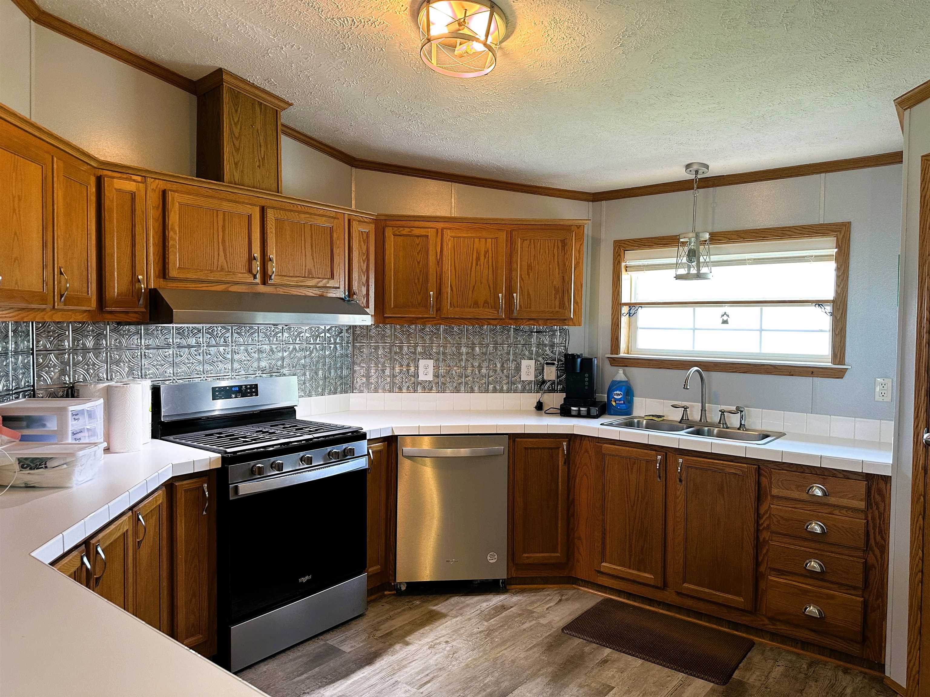 291 Highway 2 Dixon, IL 61021 - Photo 11 of 27 a kitchen with stainless steel appliances granite countertop a sink stove and cabinets