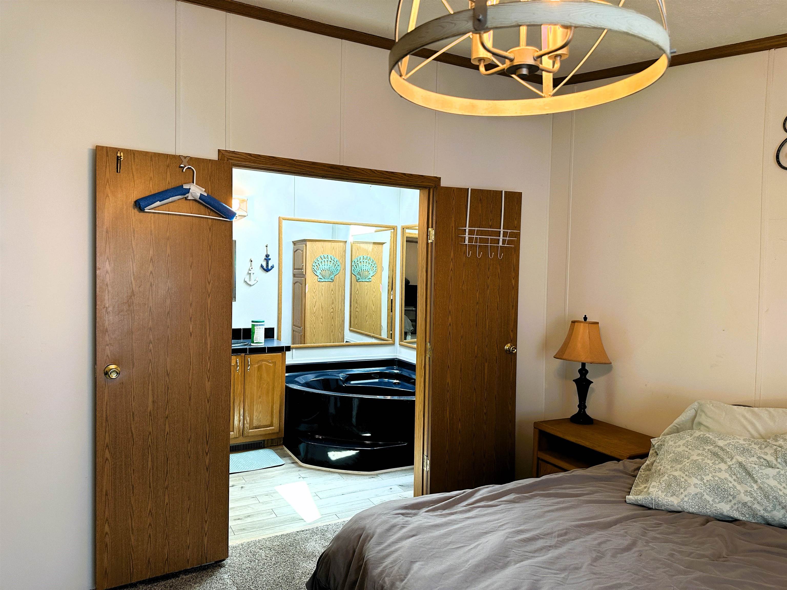 291 Highway 2 Dixon, IL 61021 - Photo 16 of 27 a bedroom with a bed and a mirror