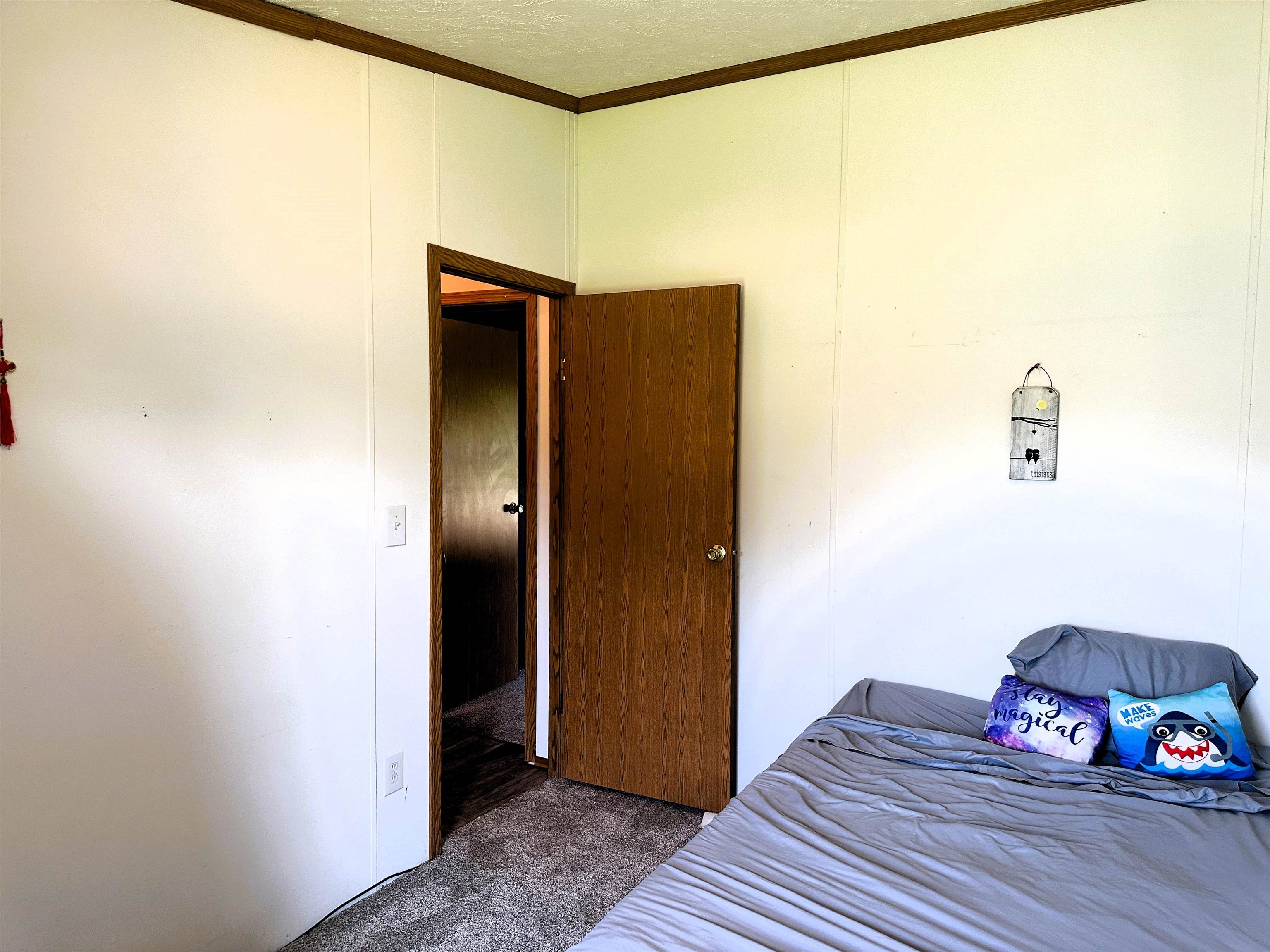 291 Highway 2 Dixon, IL 61021 - Photo 23 of 27 a view of a hallway with wooden floor and a bathroom