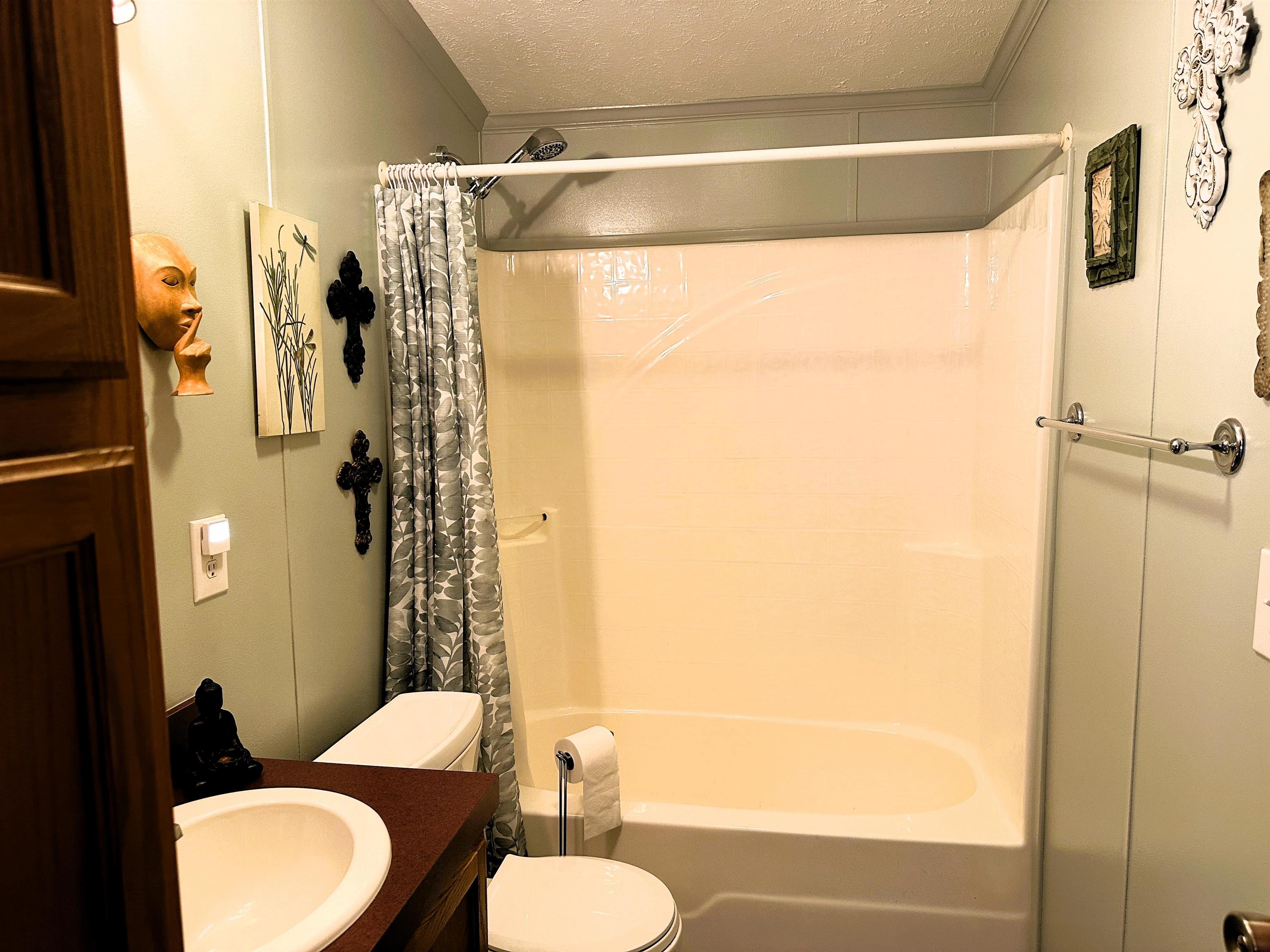 291 Highway 2 Dixon, IL 61021 - Photo 24 of 27 a bathroom with a sink and a mirror