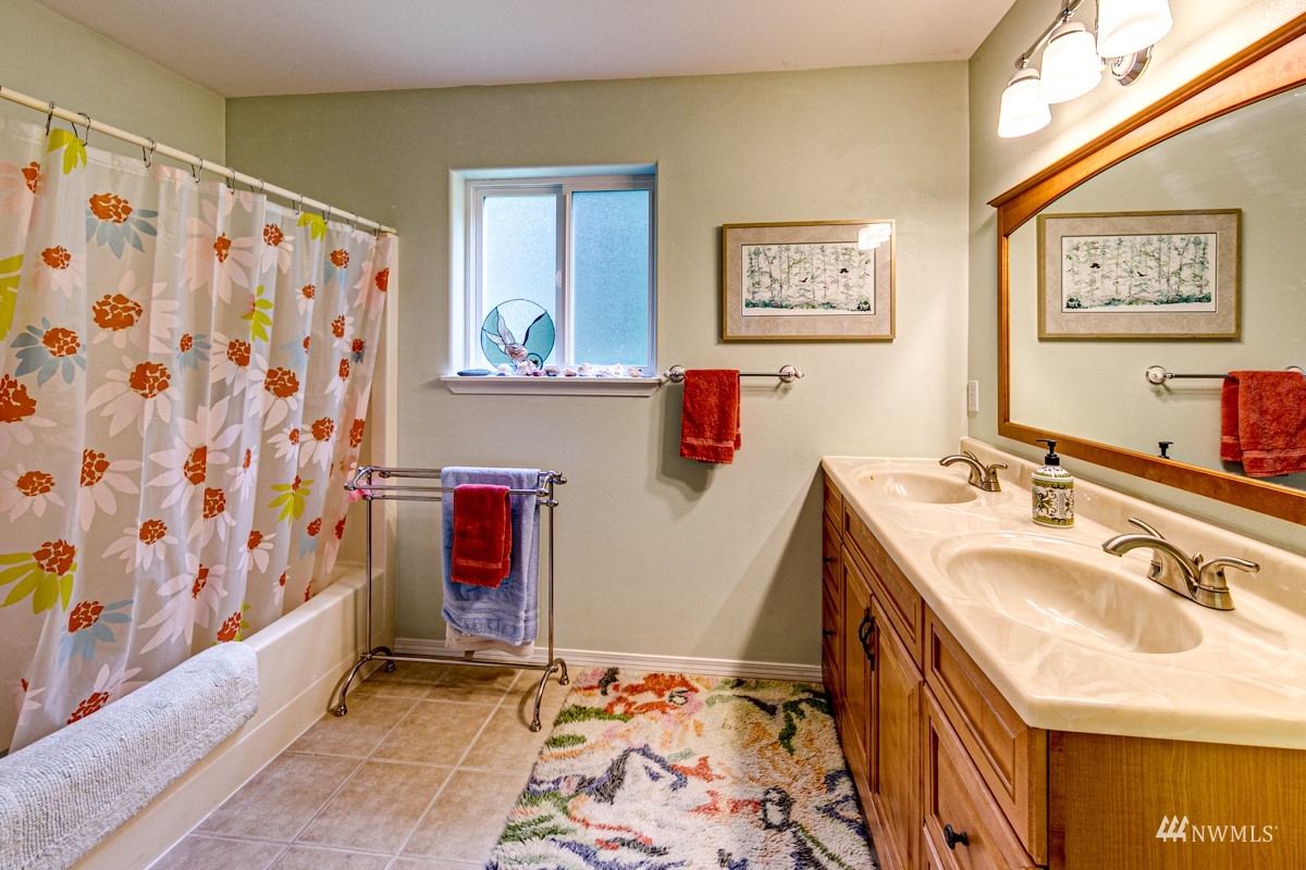 976 Township Line Road Port Angeles, WA 98362 - Photo 23 of 40 a bathroom with a sink and a mirror