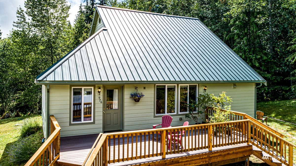 976 Township Line Road Port Angeles, WA 98362 - Photo 34 of 40 a view of a house with backyard porch and wooden floor