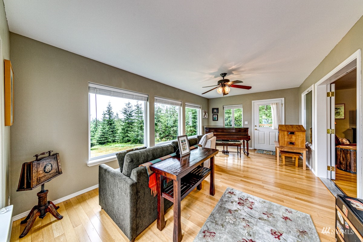976 Township Line Road Port Angeles, WA 98362 - Photo 6 of 40 a living room with furniture and a large window