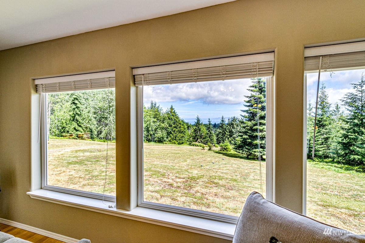 976 Township Line Road Port Angeles, WA 98362 - Photo 8 of 40 a view of a room with a large window and front door