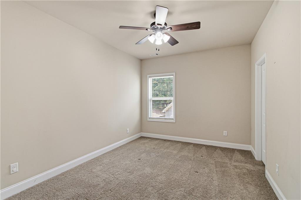 114 Madison Street Canton, GA 30115 - Photo 20 of 39 an empty room with windows and fan