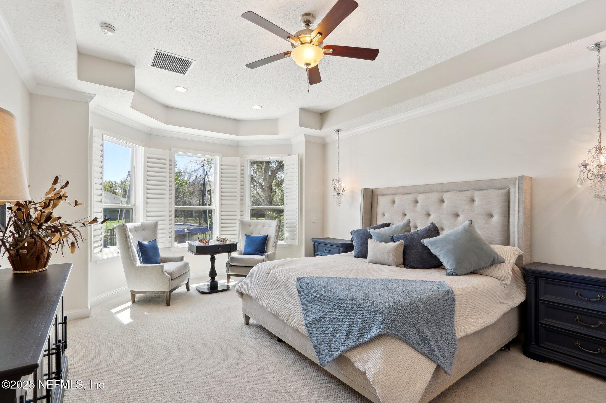 212 Cornwall Drive Ponte Vedra, FL 32081 - Photo 25 of 84 a bedroom with a large bed and a potted plant