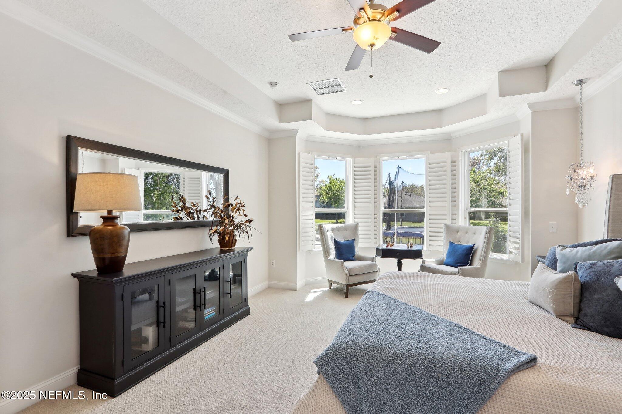 212 Cornwall Drive Ponte Vedra, FL 32081 - Photo 28 of 84 a living room with furniture large window and flat screen tv