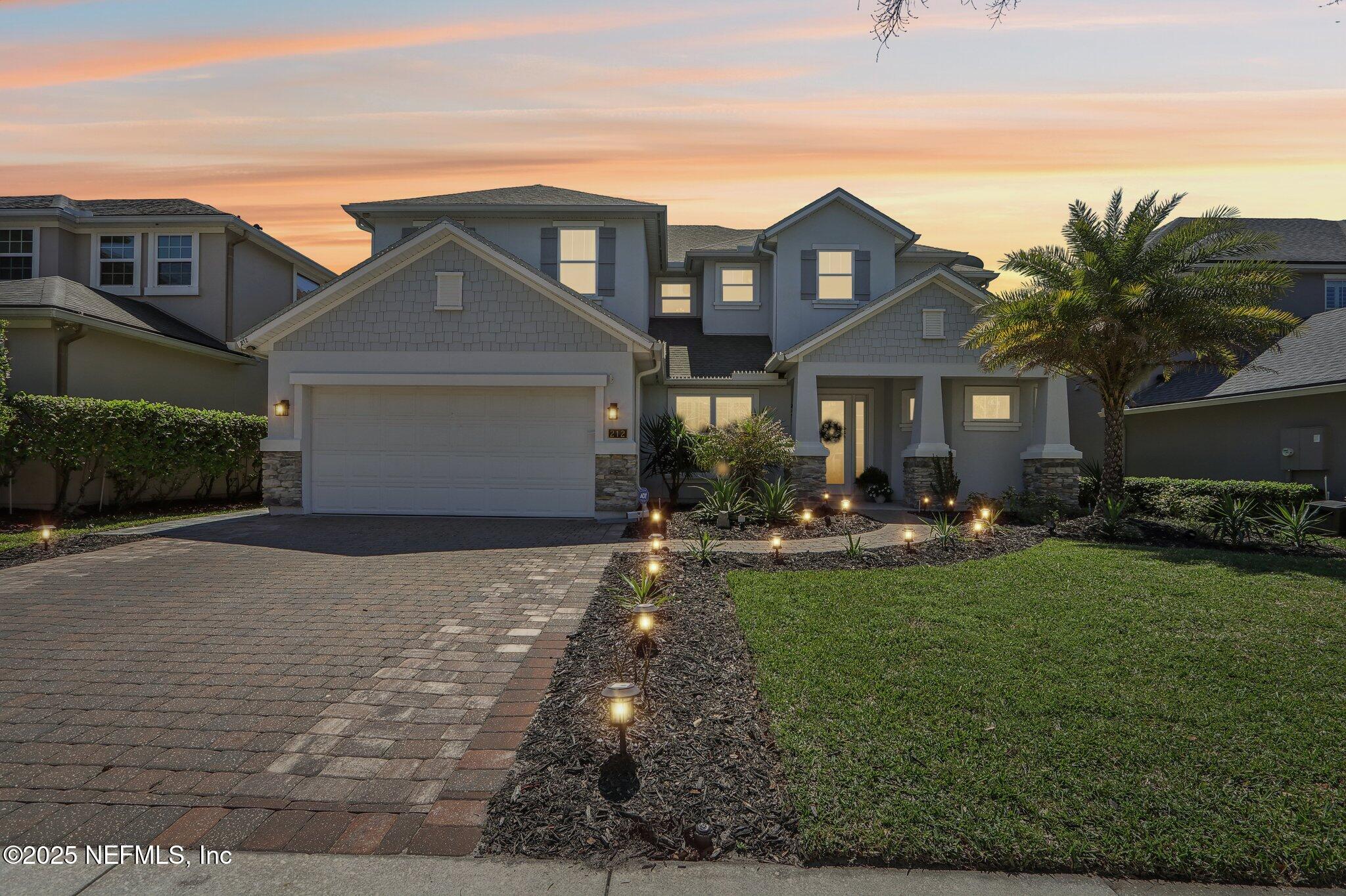 212 Cornwall Drive Ponte Vedra, FL 32081 - Photo 4 of 84 a front view of a house with garden